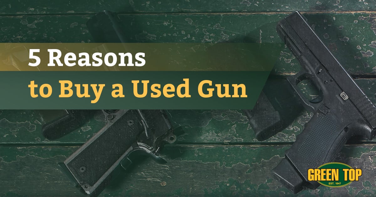 Used guns laying on a green wooden table with overlay text 5 Reasons to Buy a Used Gun
